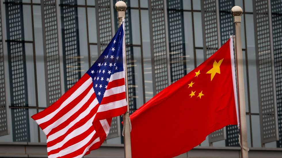 epa10975947 The flags of the USA and China flutter in Beijing, China, 15 November 2023. Chinese President Xi Jinping is set to meet US President Joe Biden on 15 November, during the Asia-Pacific Economic Cooperation (APEC) in San Francisco, California, USA.  EPA/MARK R. CRISTINO