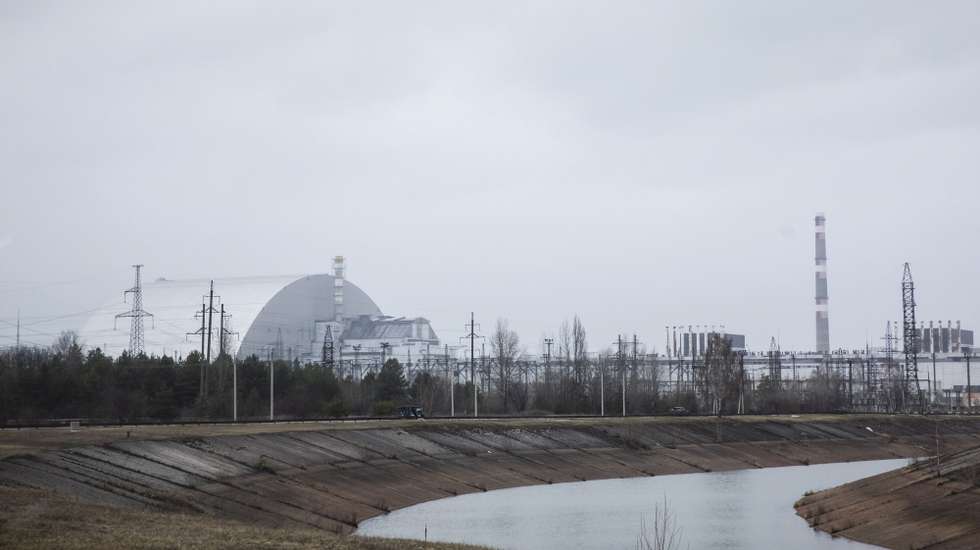 epa09879318 General view of the Chernobyl Nuclear power plant in Chernobyl, Ukraine, 08 April 2022. According to a statement on the situation in Ukraine by the International Atomic Energy Agency (IAEA) Director General on 31 March, Ukraine informed the IAEA that Russian forces that seized control of the Chernobyl Nuclear Power Plant (NPP) since 24 February 'had, in writing, transferred control of the NPP to Ukrainian personnel and moved two convoys of troops towards Belarus'. Russian troops entered Ukraine on 24 February resulting in fighting and destruction in the country and triggering a series of severe economic sanctions on Russia by Western countries.  EPA/MIKHAIL PALINCHAK