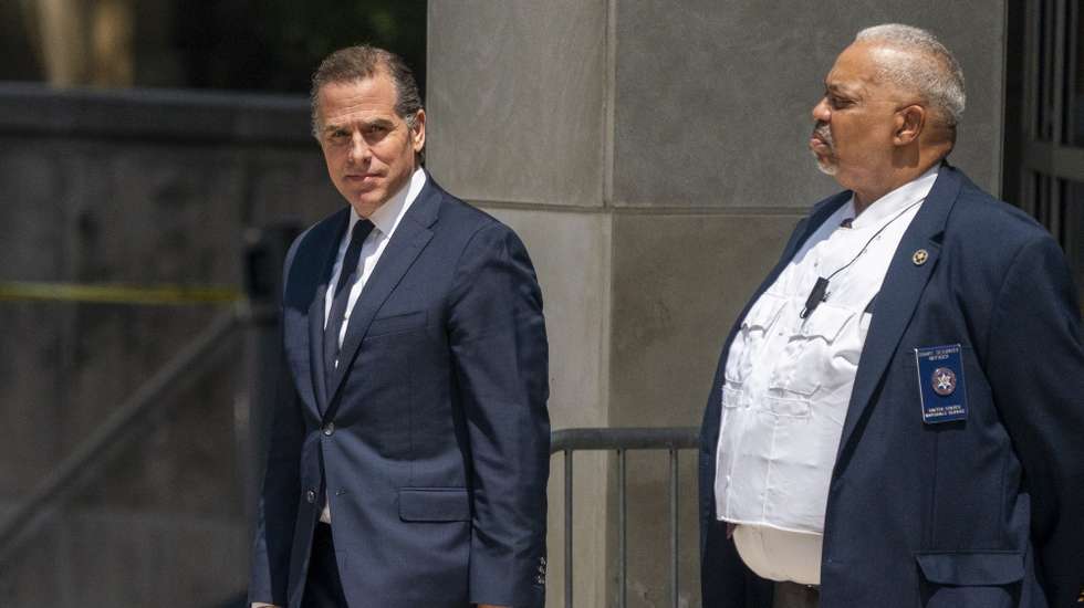 epa10770130 Hunter Biden (L) departs the US Federal District Court in Wilmington, Delaware, USA, 26 July 2023. Hunter Biden's hearing ended with him pleading not guilty after US District Judge Maryellen Noreika said she was not ready to accept the plea deal.  EPA/SHAWN THEW