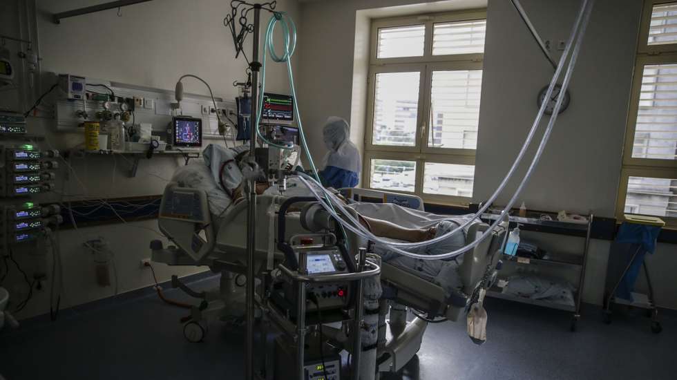27th October picture reissued 30th October of a nurse caring for a pacient at the Covid 19 Emergency Department of Santa Maria Hospital in Lisbon. The emergency room dedicated to suspected covid-19 cases at Santa Maria Hospital in Lisbon reflects the evolution of the pandemic in Portugal with patients swelling at the door to perform the test and inside the almost exhausted capacity. The fear of losing their jobs leads many patients with covid-19 to hide that they are infected and continue working, spreading the disease that, at this stage, also begins to be a social case and that leads to many hospitalizations in Santa Maria. TIAGO PETINGA/LUSA