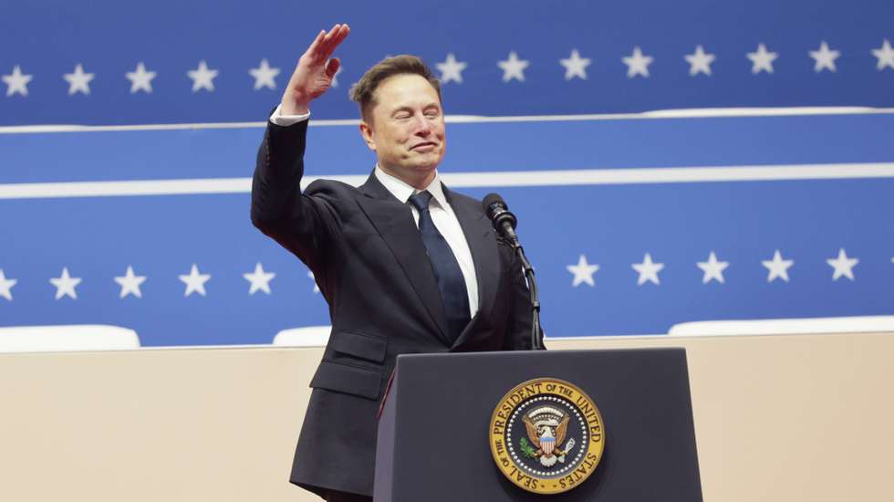 epa11840271 Tesla CEO Elon Musk gestures to the crowds at the Capitol One Arena after his address during inauguration ceremonies for US President Donald Trump in Washington, DC, USA, 20 January 2025. Trump was sworn in for a second term as president of the United States on 20 January. The presidential inauguration was held indoors due to extreme cold temperatures in DC.  EPA/ALLISON DINNER