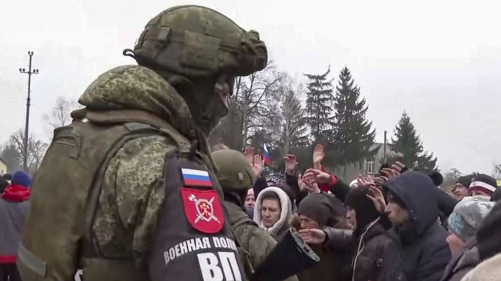 epa09798955 A handout still image taken from handout video made available by the Russian Defence ministry press-service shows Russian serviceman guard near a place where Russian humanitarian aid is distributed to Ukrainian people in Kharkiv region, Ukraine, 03 March 2022. Russian President Vladimir Putin announced a special military operation in the Donbass with the aim of demilitarising and denazifying Ukraine, as well as bringing to justice those who committed numerous bloody crimes against civilians. Martial law has been introduced in Ukraine, explosions are heard in many cities, including Kiev.  EPA/RUSSIAN DEFENCE MINISTRY PRESS SERVICE/HANDOUT HANDOUT  HANDOUT EDITORIAL USE ONLY/NO SALES