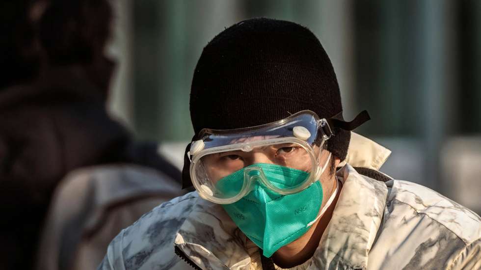 epa10375447 A traveler wearing protective gear at the Shanghai Railway Station, in Shanghai, China, 21 December 2022. According to the National Health Commission report on 21 December, China reported 3,049 locally transmitted Covid-19 cases. After easing domestic Covid-19 restrictions, Guangzhou and Chengdu made further adjustments to international passenger's quarantine policy. On 20 December, Chengdu implemented a 2+3 quarantine policy where passengers must stay 2 days in centralised quarantine and 3 days at home.  EPA/ALEX PLAVEVSKI