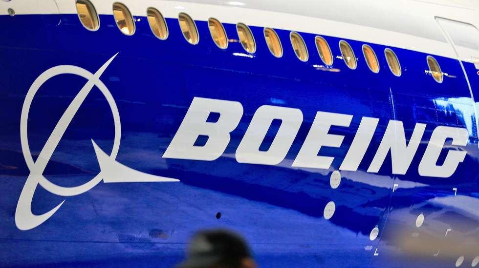 epa08368684 (FILE) - A file photo dated 14 June 2016 showing a man walking past a logo of US aircraft manufacturing company Boeing at Taoyuan airport, in Taoyuan, Taiwan (reissued 17 April 2020). Reports on 17 April 2020 state the Boeing Chief Executive Dave Calhoun told company staff Boeing would restart the production of the 747, 767, and 777 commercial airplanes at their Puget sound facilities in the Washington state on 20 April.  EPA/RITCHIE B. TONGO *** Local Caption *** 53278185