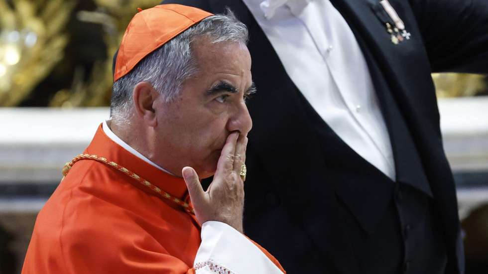 epa10141619 Cardinal Angelo Becciu attends during a consistory ceremony in the Saint Peter's basilica at the Vatican, 27 August 2022. The pontiff creates 20 new cardinals at his eighth Consistory who vote shortly afterwards on the causes for canonization of two Blesseds.  EPA/FABIO FRUSTACI