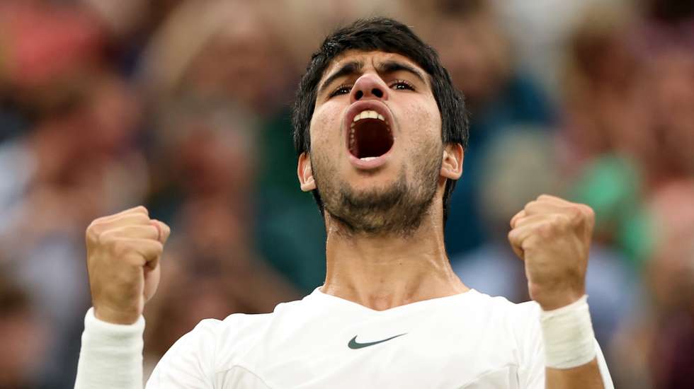 epa10738507 Carlos Alcaraz of Spain reacts after winning against Matteo Berrettini of Italy in their Men's Singles 4th round match against at the Wimbledon Championships, Wimbledon, Britain, 10 July 2023.  EPA/NEIL HALL   EDITORIAL USE ONLY