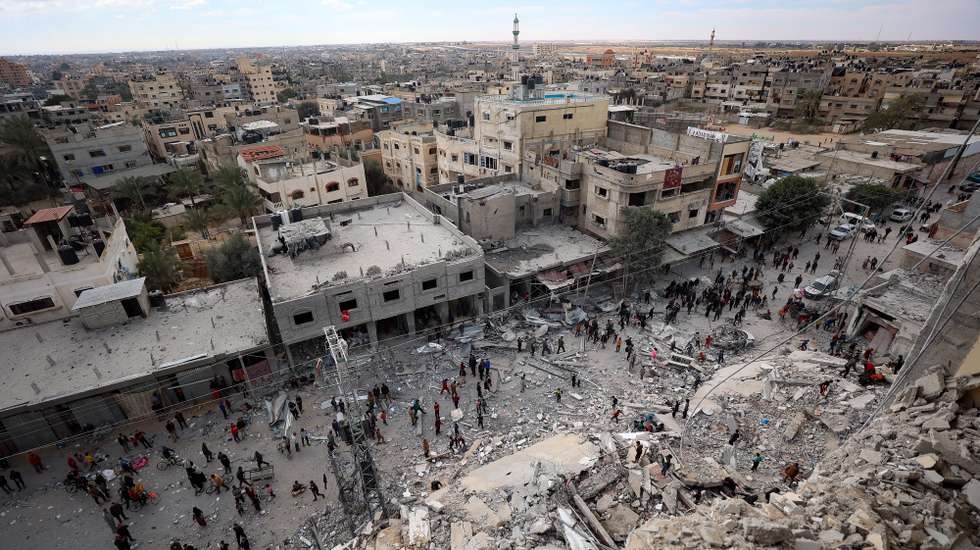 epa11208497 Palestinians inspect the area after an Israeli airstrike  hit Al Masry Tower in the Rafah refugee camp,  the southern Gaza Strip, 09 March 2024. More than 30,800 Palestinians and over 1,300 Israelis have been killed, according to the Palestinian Health Ministry and the Israel Defense Forces (IDF), since Hamas militants launched an attack against Israel from the Gaza Strip on 07 October 2023, and the Israeli operations in Gaza and the West Bank which followed it.  EPA/HAITHAM IMAD