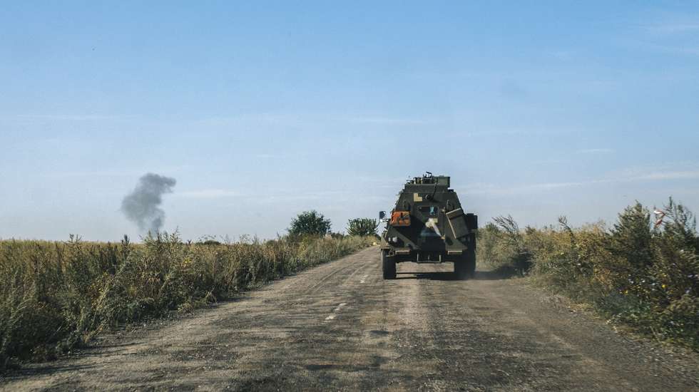 epa11551413 A military APC drives on a road as smoke rises from an explosion behind, not far from the Ukraine - Russian border in the Kursk direction of the Sumy region, Ukraine, 16 August 2024 amid the Russian invasion. Ukrainian troops have advanced 35 kilometers with battles, taken control of 1,150 square kilometers of the territory of the Russian Federation and 82 settlements since the beginning of the operation in the Kursk region on 06 August 2024 according to the report of the Commander-in-Chief of the Ukrainian Armed Forces Oleksandr Syrskyi at the meeting of the Staff on 15 August 2024. Russian troops entered Ukrainian territory on 24 February 2022, starting a conflict that has provoked destruction and a humanitarian crisis.  EPA/GEORGE IVANCHENKO