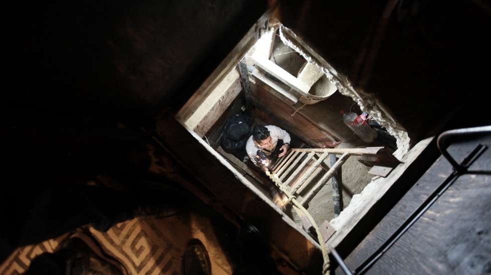 epa04695093 Policemen inspect a tunnel found in a house in Tijuana, Mexico, 07 April 2015. Mexican soldiers and federal agents found this underground tunnel close to the border line with the United States. Nine people were arrested.  EPA/Lauro Serna