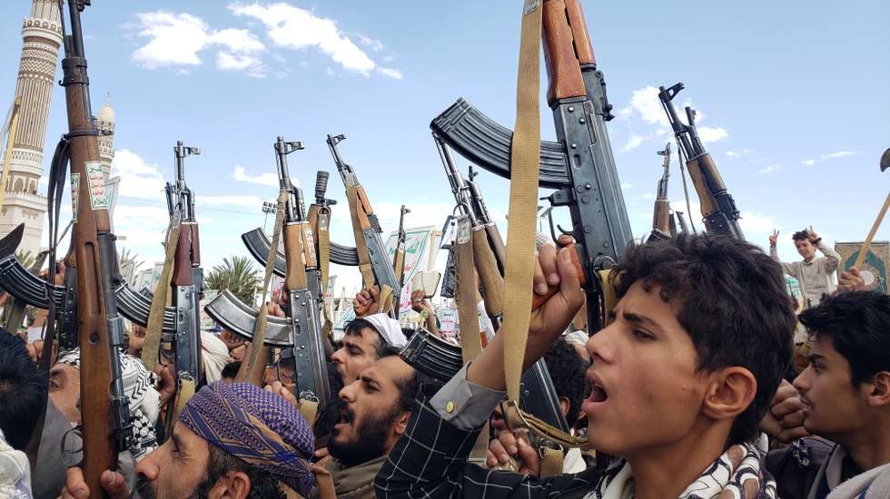 epaselect epa11969898 Houthi supporters shout slogans and hold up their weapons during a protest against the US airstrikes on Houthi positions, in Sana'a, Yemen, 17 March 2025. Houthi supporters have taken to the streets of Sana'a to protest against the US airstrikes which targeted on 15 March the Houthis-held positions in several cities of Yemen. The Houthis have vowed to target US ships in the Red Sea in retaliation for the recent US airstrikes which killed at least 53 people and wounded 98 others, according to a statement by Houthi military spokesman Yahya Sarea.  EPA/YAHYA ARHAB
