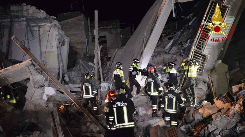 epa09637919 A handout picture provided by the Vigili del Fuoco shows rescue operations after blast caused by a gas leak in Ravanusa, Sicily, Italy, later in the night 11 December 2021 (issued 12 December 2021). Firefighters found a fourth body in the rubble of the collapsed buildings in Ravanusa. It could be a woman. Previously, the bodies of two women and a man were recovered; two survivors rescued, five people are still missing.  EPA/VIGILI DEL FUOCO HANDOUT BEST QUALITIY AVAILABLE HANDOUT EDITORIAL USE ONLY/NO SALES