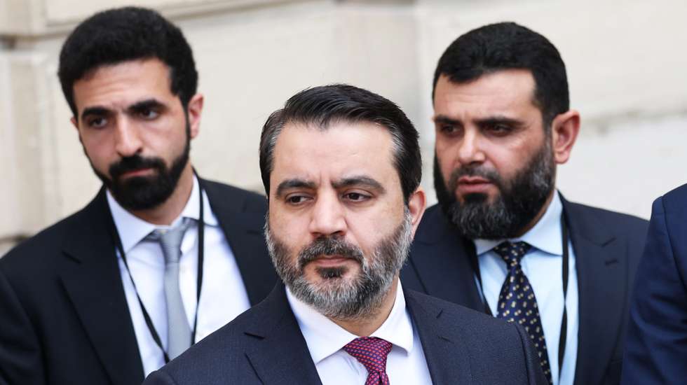 epa12081047 Syrian Foreign Minister Asaad al-Shaibani (C) arrives at the meeting between French President Emmanuel Macron (not pictured) and Syrian interim President Ahmed al-Sharaa (not pictured) at the Elysee Palace in Paris, France, 07 May 2025.  EPA/MOHAMMED BADRA