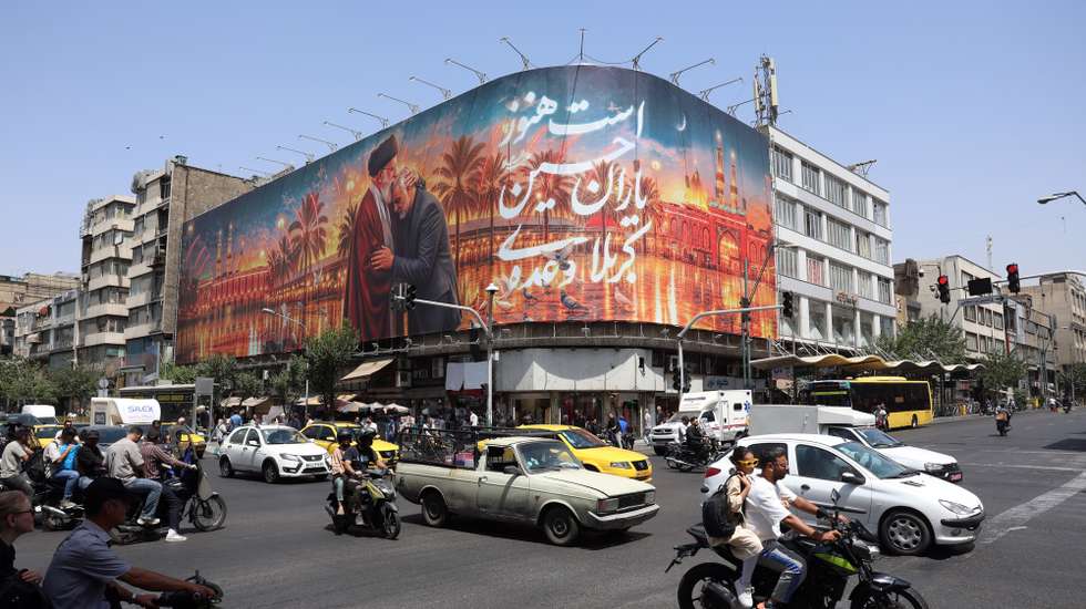 epa13071939 Iranians drive past a billboard featuring a picture of Iran's late Supreme Leader Ayatollah Ali Khamenei ahead of his funeral in Tehran, Iran, 29 June 2026. Iran is set to hold a multi-day mass funeral for the late supreme leader, amid heightened regional tensions following recent exchanges of fire between Iran and the US despite a recently signed agreement.  EPA/ABEDIN TAHERKENAREH RESTRICTIONS: NO Access Israel Media/Persian Language TV Stations Outside Iran/Strictly No Access BBC Persian/VOA Persian/Manoto TV/Iran International TV. (As mandated by Iran's Directorate General for Foreign Media) --