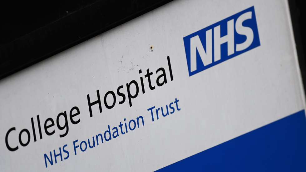 epa09798567 A NHS Trust sign outside a NHS hospital in London, Britain 03 March 2022. The UK's national health service (NHS) is coming under pressure to ditch contracts it holds with Russian energy giant Gazprom, after two former British Health Secretaries called for the Gazprom contracts to be cut.  EPA/ANDY RAIN