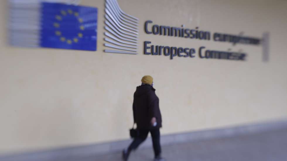 epa08795886 A picture taken with Lensbaby shows a person walking in front of European Commission headquarters in Brussels, Belgium, 03 November 2020.  EPA/OLIVIER HOSLET Taken with Lensbaby