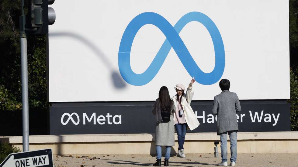 epa11757744 People take photos at the Meta signage in front of the Meta Platforms (Meta) headquarters in Menlo Park, California, USA, 04 December 2024. Meta Platforms stock hits a 52-week high, up 73.3 percent year to date (YTD). CEO Mark Zuckerberg announced to ramp up AI investments into next year.  EPA/JOHN G. MABANGLO