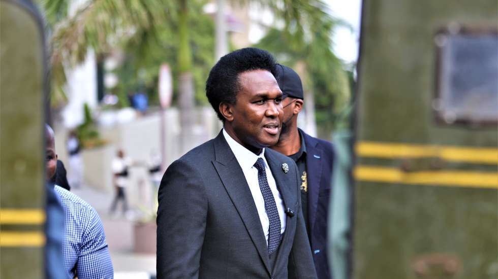 epaselect epa12252887 Riot police blocks media looking at Venancio Mondlane at the office of the attorney general (PGR) in Maputo, Mozambique, 22 July 2025. Venancio Mondlane was charged by the Mozambican public prosecutor’s office with five crimes in connection with the post-election demonstrations, including incitement to collective disobedience and instigation of terrorism.  EPA/LUÍSA NHANTUMBO