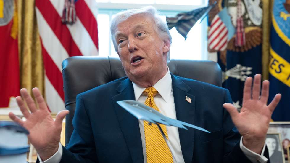 epa12826172 US President Donald Trump gives remarks with a model stealth bomber on the Resolute Desk during an Executive Order signing event in the Oval Office of the White House in Washington, DC, USA, 16 March 2026. The order will formally launch a task force, led by Vice President JD Vance, to investigate fraud nationwide.  EPA/AARON SCHWARTZ / POOL