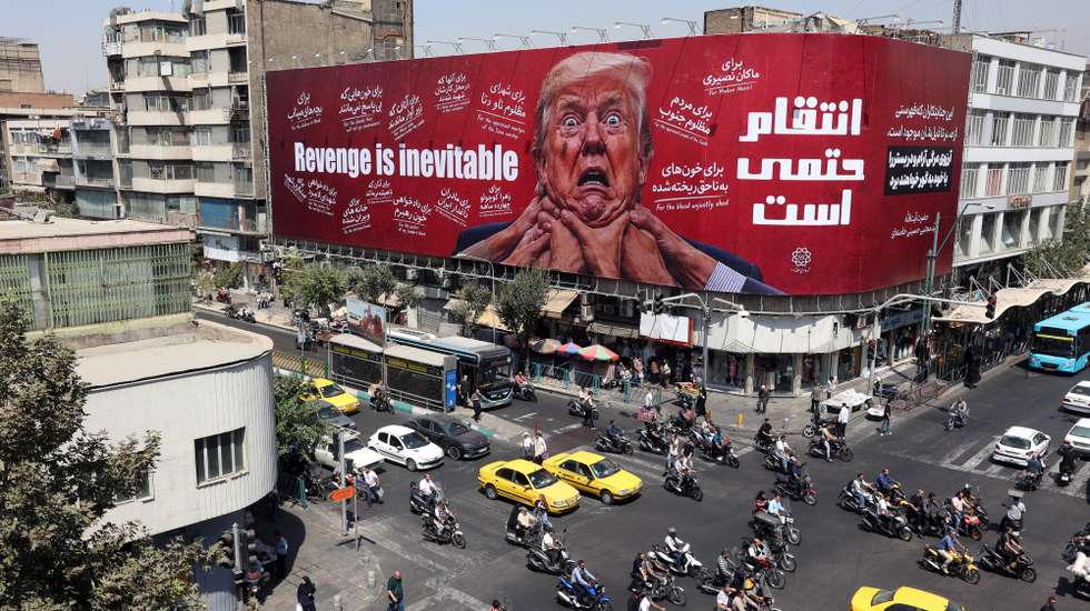 epa13178258 Iranians drive near an anti-Trump billboard in Tehran, Iran, 19 August 2026. Iranian parliament speaker Mohammad Bagher Ghalibaf said that the Strait of Hormuz will remain closed until the United States lifts its blockade and ends sanctions.  EPA/ABEDIN TAHERKENAREH RESTRICTIONS: NO Access Israel Media/Persian Language TV Stations Outside Iran/Strictly No Access BBC Persian/VOA Persian/Manoto TV/Iran International TV. (As mandated by Iran's Directorate General for Foreign Media) --