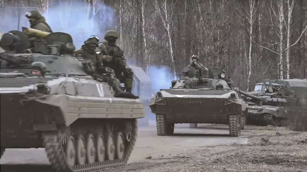epa09807293 A still image taken from a handout video made available by the Russian Defence Ministry press service shows Russian servicemen drive on armoured military vehicle on the road near Kyiv (Kiev), Ukraine, 07 March 2022. Russian President Putin on 24 February 2022 announced a "special military operation against Ukraine". Martial law has been introduced in Ukraine, and explosions are heard in many cities including Kyiv.  EPA/RUSSIAN DEFENCE MINISTRY PRESS SERVICE/HANDOUT HANDOUT  HANDOUT EDITORIAL USE ONLY/NO SALES