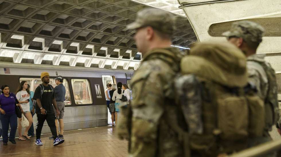 epa12313484 Members of the National Guard patrol inside Metro Center Station in Washington DC, USA, 20 August 2025. As President Trump's takeover of Washington, DC, policing enters its second week, Mississippi joins three other Republican-led states that have vowed to deploy National Guard members in support of the Trump administration's operation.  EPA/WILL OLIVER