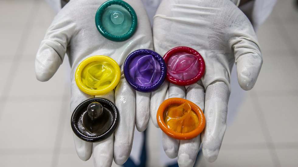 epa07193882 (FILE) - A worker holds a variety of colored condoms at the Karex condom factory in Port Klang, Malaysia, 17 January 2015 (reissued 27 November 2018). The French Health Ministry on 27 November 2018 announced that France is to reimburse the costs of prescribed condoms bought at pharmacies from 10 December 2018 on.  EPA/AZHAR RAHIM *** Local Caption *** 51792702