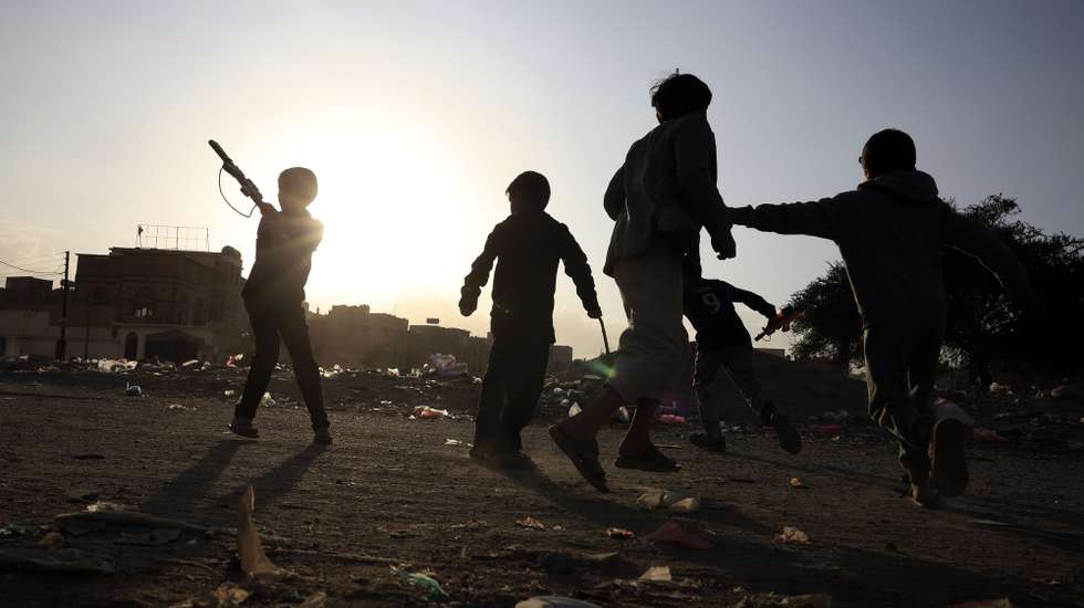 epa12609113 Yemeni children play a war game with toy weapons in a neighborhood of Sana'a, Yemen, 22 December 2025. UNICEF has warned of the impacts of a decade of Yemen's conflict on children, with over 10 million children living in deprivation, including 4.5 million out of school.  EPA/YAHYA ARHAB