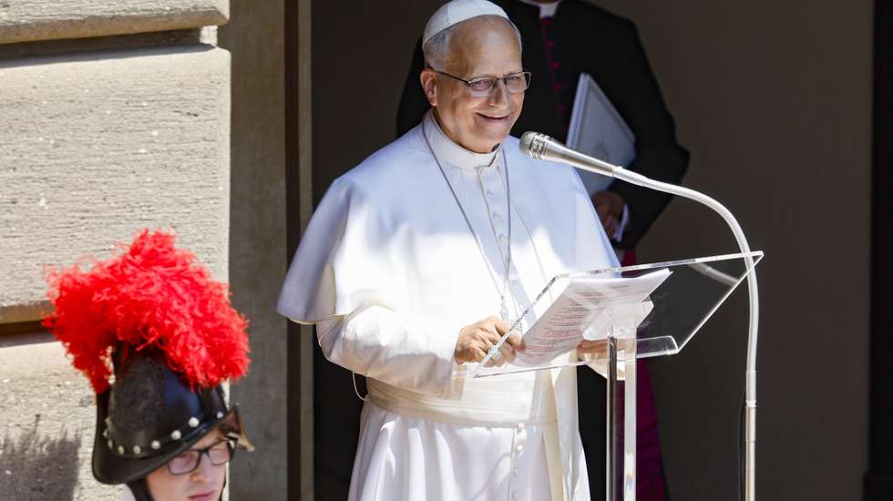 epa13106715 Pope Leo XIV delivers the Angelus prayer from the entrance of the Apostolic Palace overlooking Piazza della Liberta at the papal summer residence in Castel Gandolfo, near Rome, Italy, 12 July 2026.  EPA/FABIO FRUSTACI