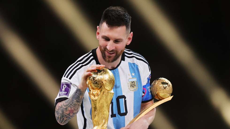 epa13202782 (FILE) - Lionel Messi of Argentina touches the World Cup trophy as he passes it after winning the golden ball award during the awards ceremony after the FIFA World Cup 2022 Final between Argentina and France at Lusail stadium, Lusail, Qatar, 18 December 2022 (Reissued 31 August 2026). Lionel Messi announed his retirement from international soccer on 31 August 2026.  EPA/FRIEDEMANN VOGEL