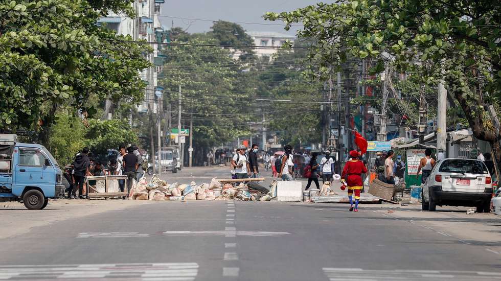 epa09100787 Roadblocks are setup by demonstrators during a protest against the military coup in Yangon, Myanmar, 27 March 2021. Anti-coup protests continue as Myanmar's junta held a military parade in a major show of strength for the annual Armed Forces Day on 27 March in Naypyitaw.  EPA/STRINGER