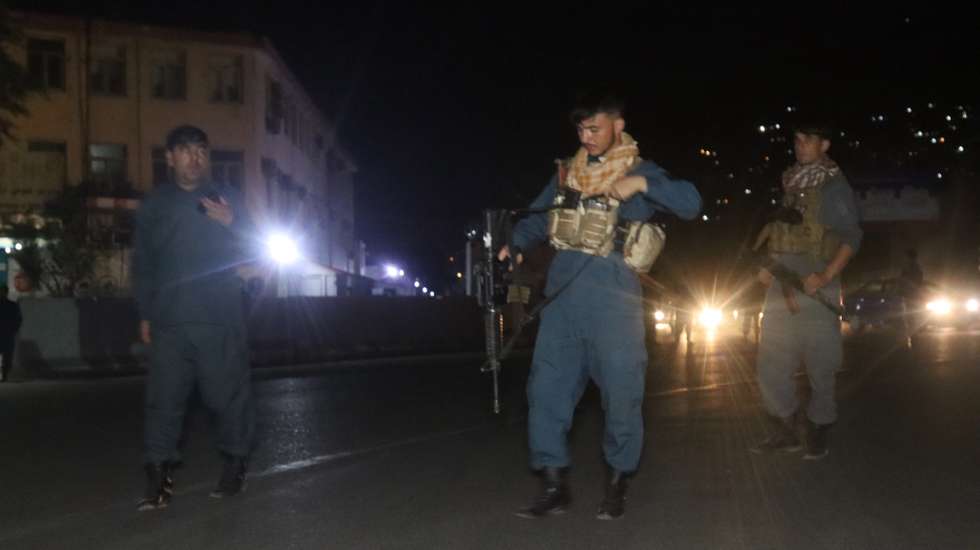 epa09392373 Afghan security officials stand guard on a road leading to the scene of a huge explosion in Kabul, Afghanistan, 03 August 2021. A powerful explosion hit the Kabul's green zone where most of the foreign missions and government buildings are located.  EPA/JAWED KARGAR BEST QUALITY AVAILABLE