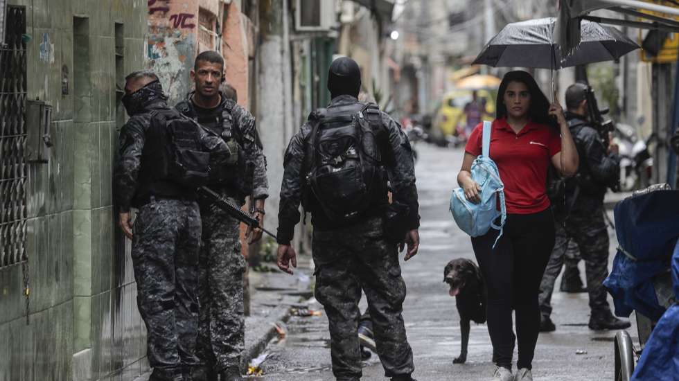 epa10909718 Police participate in an operation against criminal gangs in a favela in Rio de Janeiro, Brazil, 09 October 2023.  Nearly 1,000 police officers were deployed in three of the most violent favelas in Rio de Janeiro in a mega-operation with which authorities seek to catch leaders of the Red Command, one of the most dangerous criminal organizations in Brazil, official sources reported. The actions took place in Complexo da Mare, Vila Cruzeiro and Cidade de Deus, where the agents seek to fulfill 100 arrest warrants, according to the secretary of the Civil Police of the state of Rio de Janeiro, Jose Renato Torres, in a press conference.  EPA/Antonio Lacerda