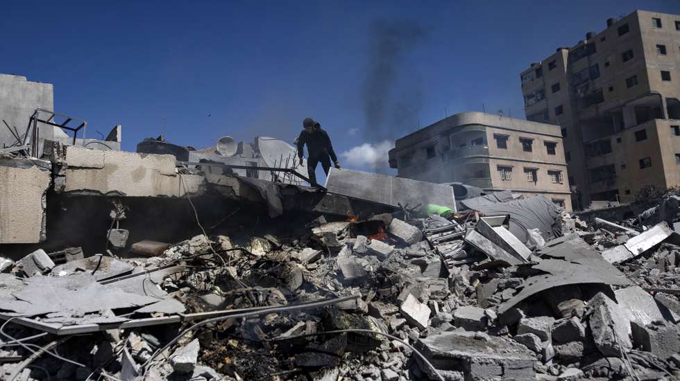 epa11974173 A Palestinian man inspects a destroyed house after an Israeli airstrike in Gaza City, northern Gaza Strip, 19 March 2025. On 18 March, Israeli forces resumed airstrikes on Gaza ending a ceasefire held in place since 19 January, and killing over 400 people, the Palestinian Ministry of Health in Gaza said.  EPA/HAITHAM IMAD
