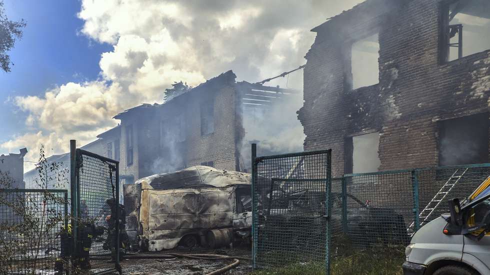 epa13028461 Ukrainian rescuers work at the site of a Russian strike on a residential area in Kharkiv, Ukraine, 10 June 2026, amid the ongoing Russian invasion. At least 10 people were injured as Russia attacked Kharkiv, according to the State Emergency Service report.  EPA/SERGEY KOZLOV 119339