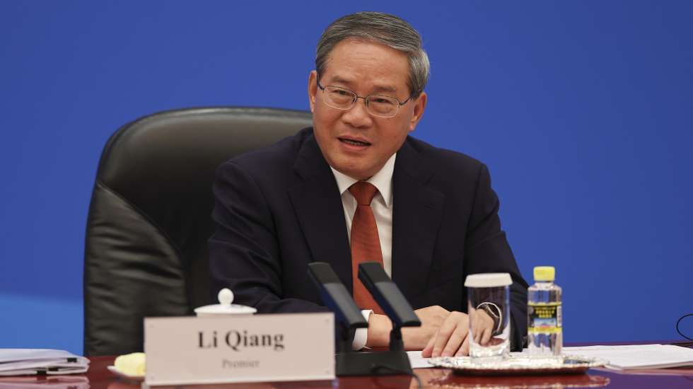 epa12956239 Chinese Premier Li Qiang meets with US business representatives, at the Great Hall of the People in Beijing, China, 14 May 2026. US President Trump is in Beijing for a high-stakes state visit running through 15 May, marking his first return to the mainland since 2017.  EPA/GO NAKAMURA / POOL