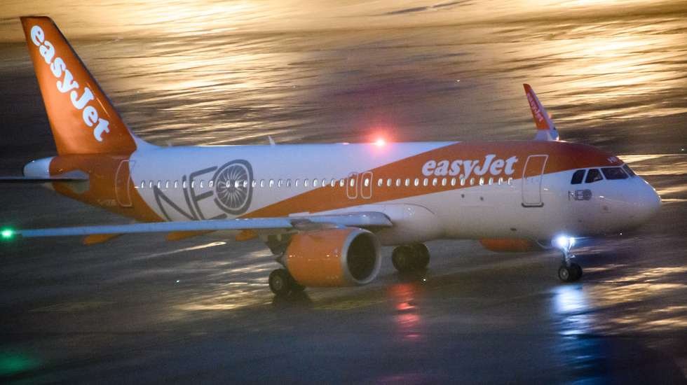 epa08790250 An EasyJet plane, starting as the first commercial flight since the airport’s opening, drives on the apron towards the tarmac, a day after the official opening of BER Berlin Brandenburg Airport in Schoenefeld, Germany, 01 November 2020. The BER airport was opened on 31 October 2020 nearly nine years after it was supposed to open in the year 2011. A series of technical issues and general mismanagement led to a six-time postponement of the opening. On 31 October 2020 two planes landed during the opening ceremony, 24 years after the construction decision of the airport was made.  EPA/CLEMENS BILAN