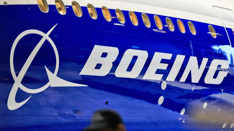 epa08967893 (FILE) - A file photo dated 14 June 2016 showing a man walking past a logo of US aircraft manufacturing company Boeing at Taoyuan airport, in Taoyuan, Taiwan (reissued 26 January 2021). Boeing is due to release its 4th quarter 2020 results on 27 January 2021.  EPA/RITCHIE B. TONGO *** Local Caption *** 56030419