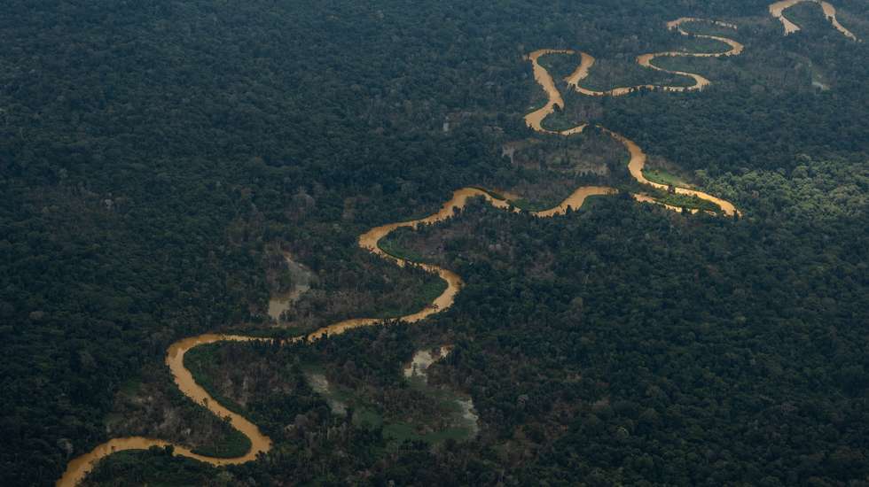 epa10444792 The dark waters of Mucajai river, due to the presence of illegal mining during a Brazilian Air Force mission to deliver supplies to the Yanomami people living on Indigenous Land near the Surucucu military base, in the Amazonian state of Roraima, Brazil, 02 February 2023. The mission departed from the Boa Vista Air Base, the state capital, in an Embraer KC-390 cargo plane. The Yanomami people are experiencing a humanitarian crisis due to the presence of illegal mining on their lands.  EPA/Raphael Alves
