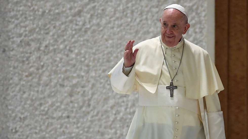 epa09428459 Pope Francis greets faithful as he arrives to lead the weekly general audience in Paolo VI Hall , Vatican City,  25 August 2021.  EPA/ETTORE FERRARI
