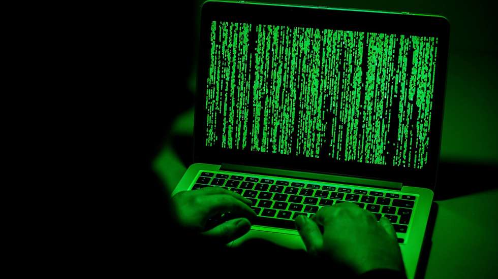 epa07261857 ILLUSTRATION - A person sits in front of a computer screen in Moers, Germany, 04 January 2019. Reports on 04 January 2019 state personal data of hundreds of German politicians, celebrities and journalists have been hacked and posted online. The compromised data reportedly includes credit card details, private chat protocols and contact information. The data was allegedly shared via a Twitter account under the name G0d (@_0rbit) prior to Christmas 2018, which has been suspended in the meantime.  EPA/SASCHA STEINBACH