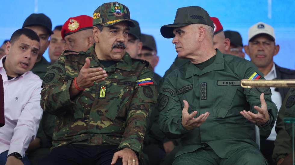 epa12549121 Venezuelan President Nicolas Maduro (L) speaks with Venezuelan Minister of Defence Vladimir Padrino Lopez during an event marking the bicentennial of the delivery of the Sword of Peru to Simon Bolivar, in Caracas, Venezuela, 25 November 2025.  EPA/MIGUEL GUTIERREZ
