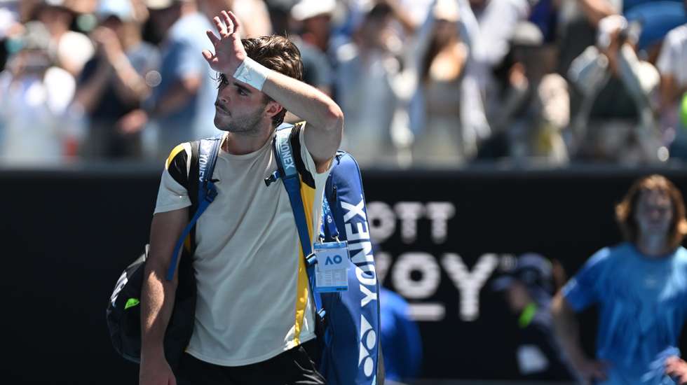 epa12666339 Jaime Faria of Portugal greets the crowd after losing his Men's Singles match against Andrey Rublev of Russia on day 4 of the Australian Open tennis tournament at Margaret Court Arena in Melbourne, Australia, 21 January 2026.  EPA/LUKAS COCH  AUSTRALIA AND NEW ZEALAND OUT
