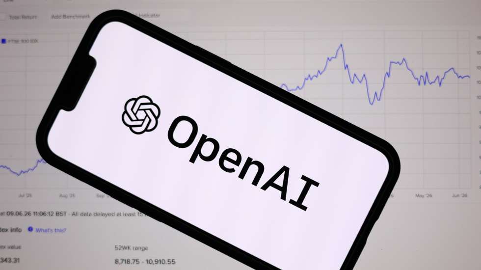epa13026233 The OpenAI logo is displayed on a mobile phone over a stock market graph displayed on a laptop screen in Liverpool, Britain, 09 June 2026. Leading AI (artificial intelligence) and technology companies Anthropic, OpenAI, and SpaceX are preparing to go public this year at an estimated combined valuation of around four trillion dollars (approximately 3.44 trillion euros).  EPA/ADAM VAUGHAN