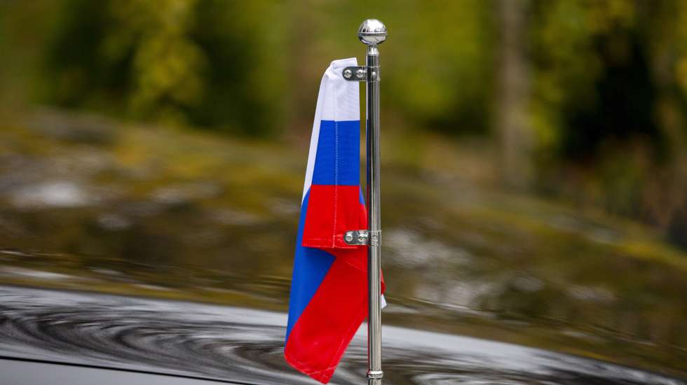 epa10325152 The Russian flag seen as ambassador Oleg Vasnetsov (not seen) speaks to media after he was summoned to the Moldavian Foreign Ministry in Chisinau, Moldova, 24 November 2022. Vasnetsov was summoned after Moldova faced massive power outages in the capital and across the country following Russia's bombing of the Ukrainian energy system in the afternoon of 23 November. Moldovan Foreign Minister Nicu Popescu said 'Russia's attacks on Ukraine's energy infrastructure have left Moldova in the dark, again. I instructed that Russia's ambassador be summoned for explanations'.  EPA/DUMITRU DORU