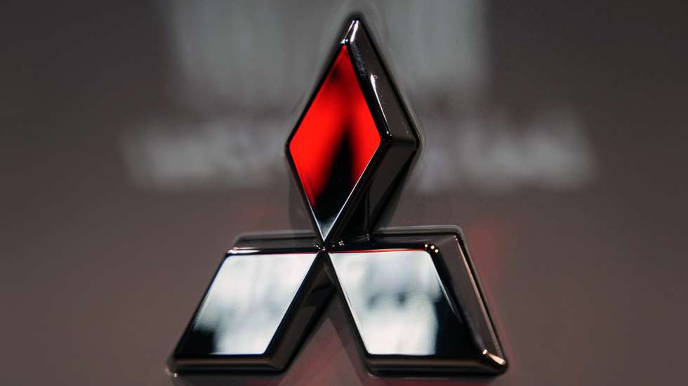epa11326270 The Mitsubishi Motors logo is seen on a vehicle displayed at a carmaker showroom in Tokyo, Japan, 08 May 2024. Mitsubishi Motors Corporation announced its full-year financial results for FY2023, showing that its consolidated net sales for the full fiscal year rose 13 percent year on year.  EPA/FRANCK ROBICHON