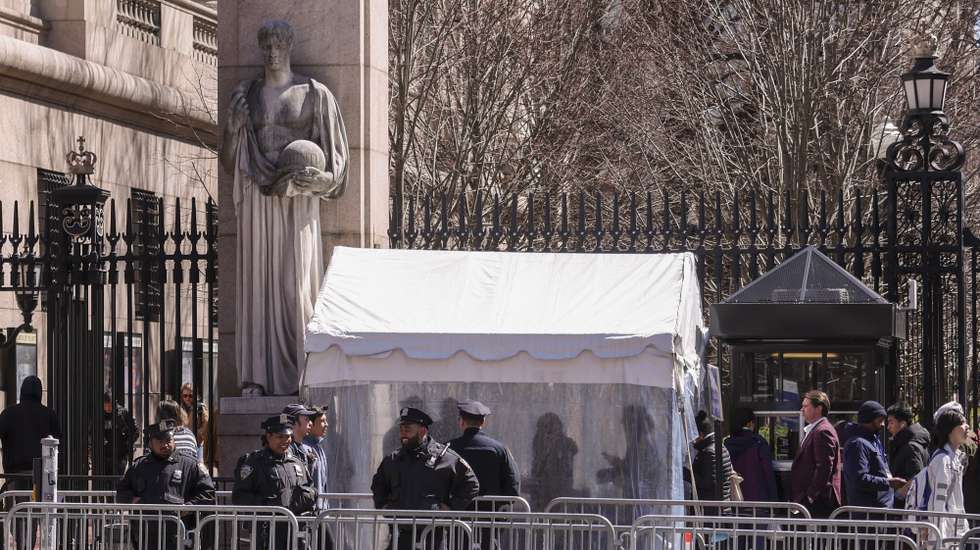 epa11992626 Students, faculty and visitors enter campus by going through security near the Broadway entrance of Columbia University in New York, New York, USA, 27 March 2025. The university agreed to the Trump administration demands, including strict rules for protests and disciplinary processes, to restore the 400 million US dollar in federal funding it was stripped of earlier this month.  EPA/SARAH YENESEL