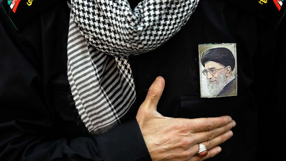 epa12785901 (FILE) - An Iranian worshipper gestures next to a picture of Iranian Supreme Leader Ayatollah Ali Khamenei on his chest as he takes part in a Friday prayer ceremony at Imam Khomeini mosque in Tehran, Iran, 05 January 2018 (reissued 01 March 2026). According to a statement from Iranian state media issued on 01 March 2026, Iranian Supreme Leader Ayatollah Ali Khamenei was killed in an airstrike during a joint USA-Israeli military campaign that began on 28 February 2026.  EPA/ABEDIN TAHERKENAREH *** Local Caption *** 53988598