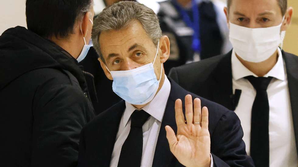 epa08874538 Former French president Nicolas Sarkozy (C) arrives at the court for his trial on corruption charges in the so-called 'wiretapping affair' in Paris, France, 10 December 2020. In 2013, Nicolas Sarkozy was using a false name, Paul Bismuth, to make phone calls to his lawyer, Thierry Herzog, about the decision that the Court of Cassation was about to take regarding the seizure of presidential diaries in a separate case. The trial is due to run from 23 November to 10 December 2020.  EPA/YOAN VALAT