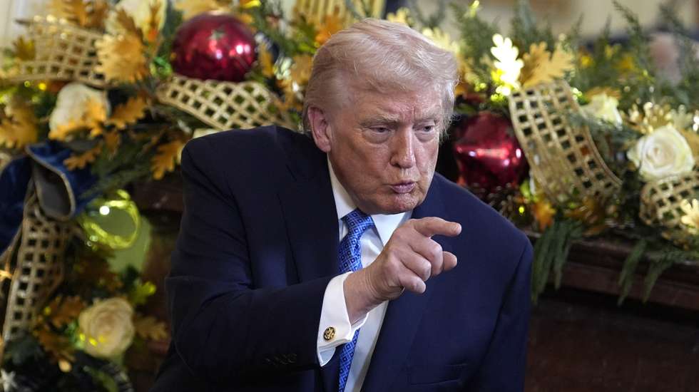 epa12597492 US President Donald Trump gestures during a Hanukkah reception in the East Room at the White House in Washington, DC, USA, 16 December 2025.  EPA/YURI GRIPAS / POOL