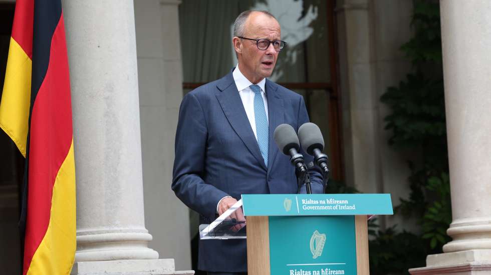 epa13137036 German Chancellor Friedrich Merz speaks to the media during a press conference with the Irish Taoiseach at Farmleigh House in Dublin, Ireland, 28 July 2026. Merz is in Dublin for talks with the Taoiseach during Ireland’s six-month presidency of the EU Council.  EPA/DAMIEN EAGERS